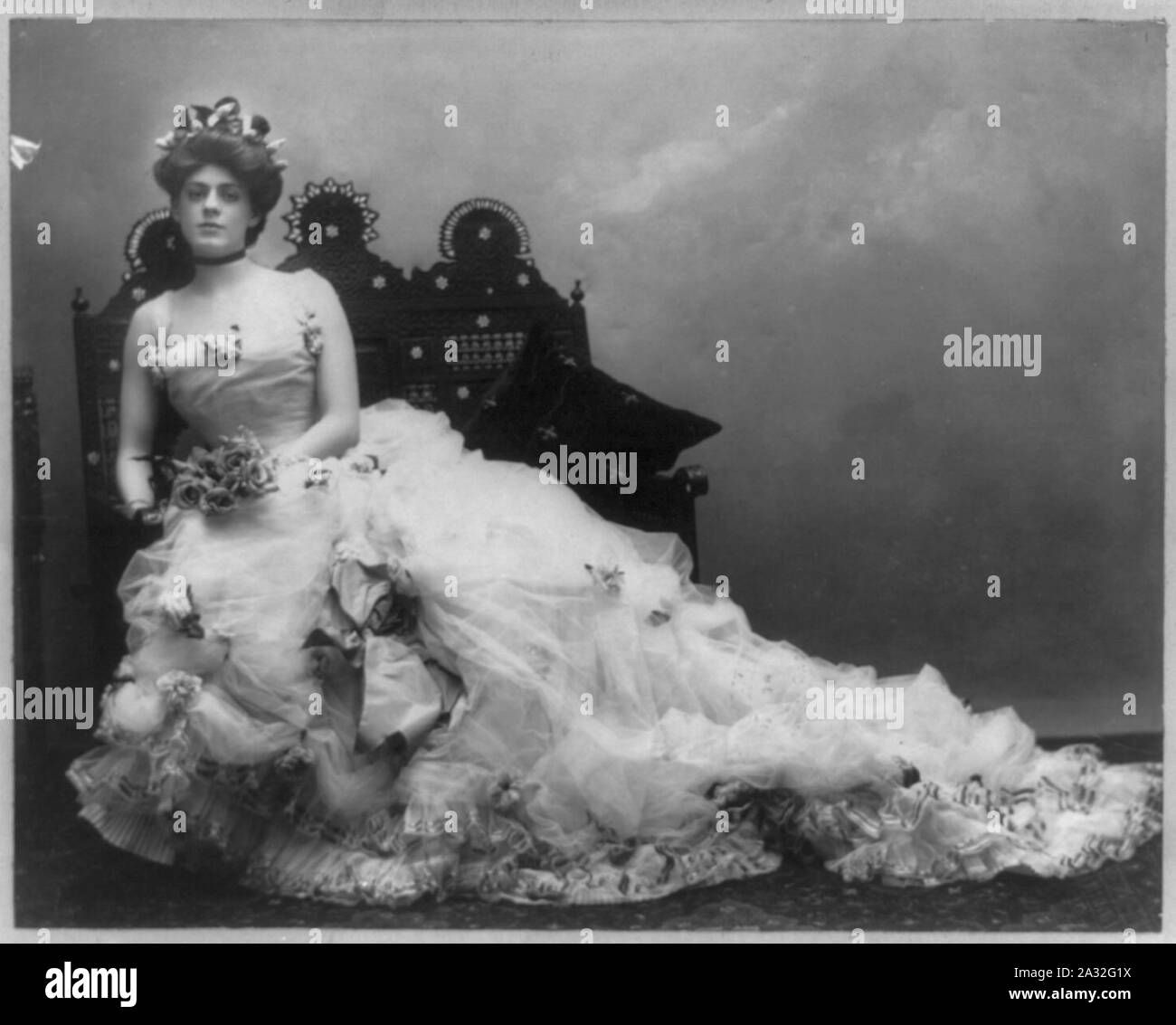 Ethel Barrymore, 1879-1959, full length portrait, seated, wearing long