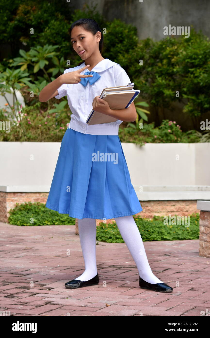 Youthful Minority Girl Student And Peace Sign With School Books Stock ...