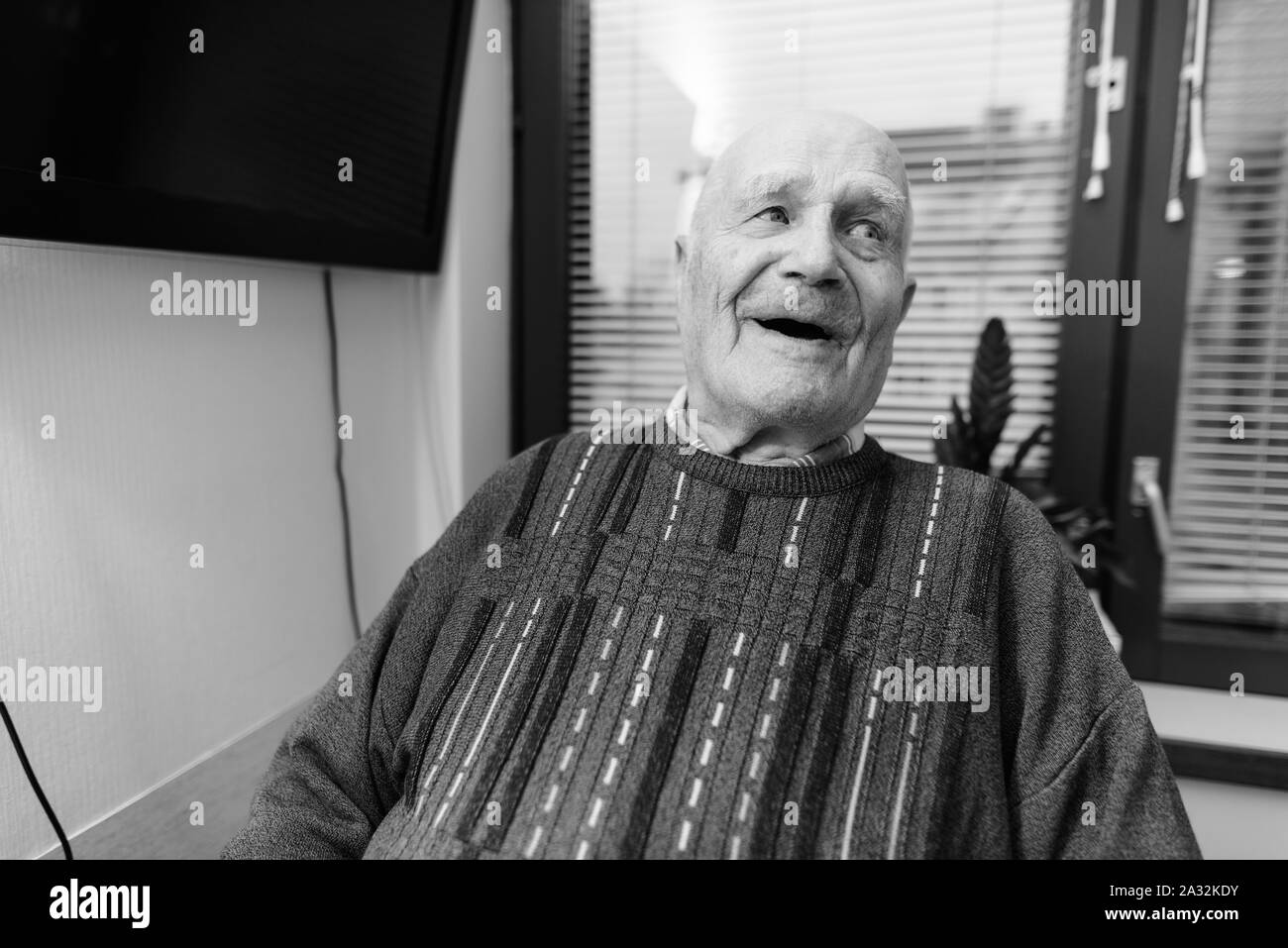 Senior man relaxing at nursing home in Turku, Finland Stock Photo