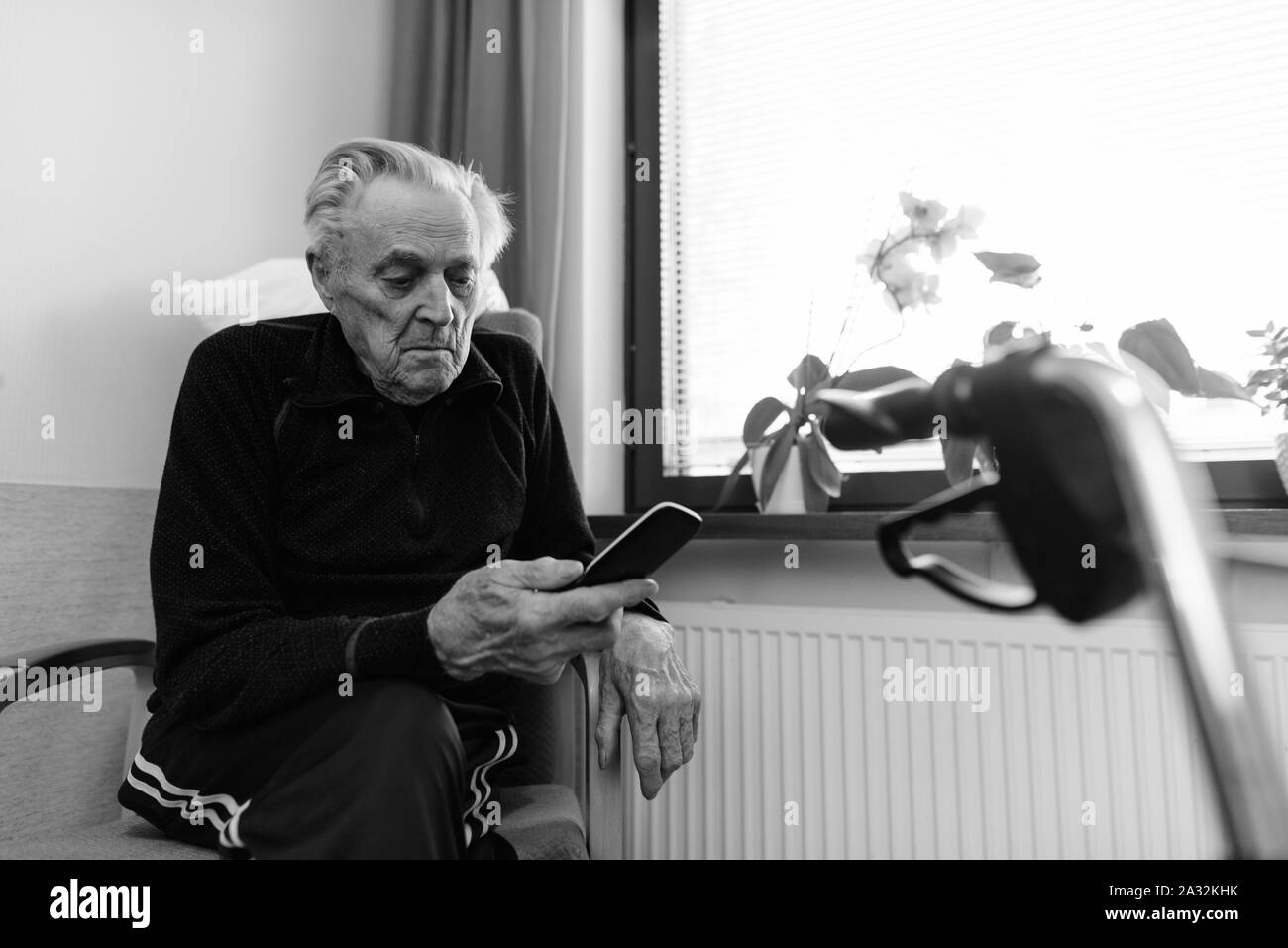 Senior man relaxing at nursing home in Turku, Finland Stock Photo