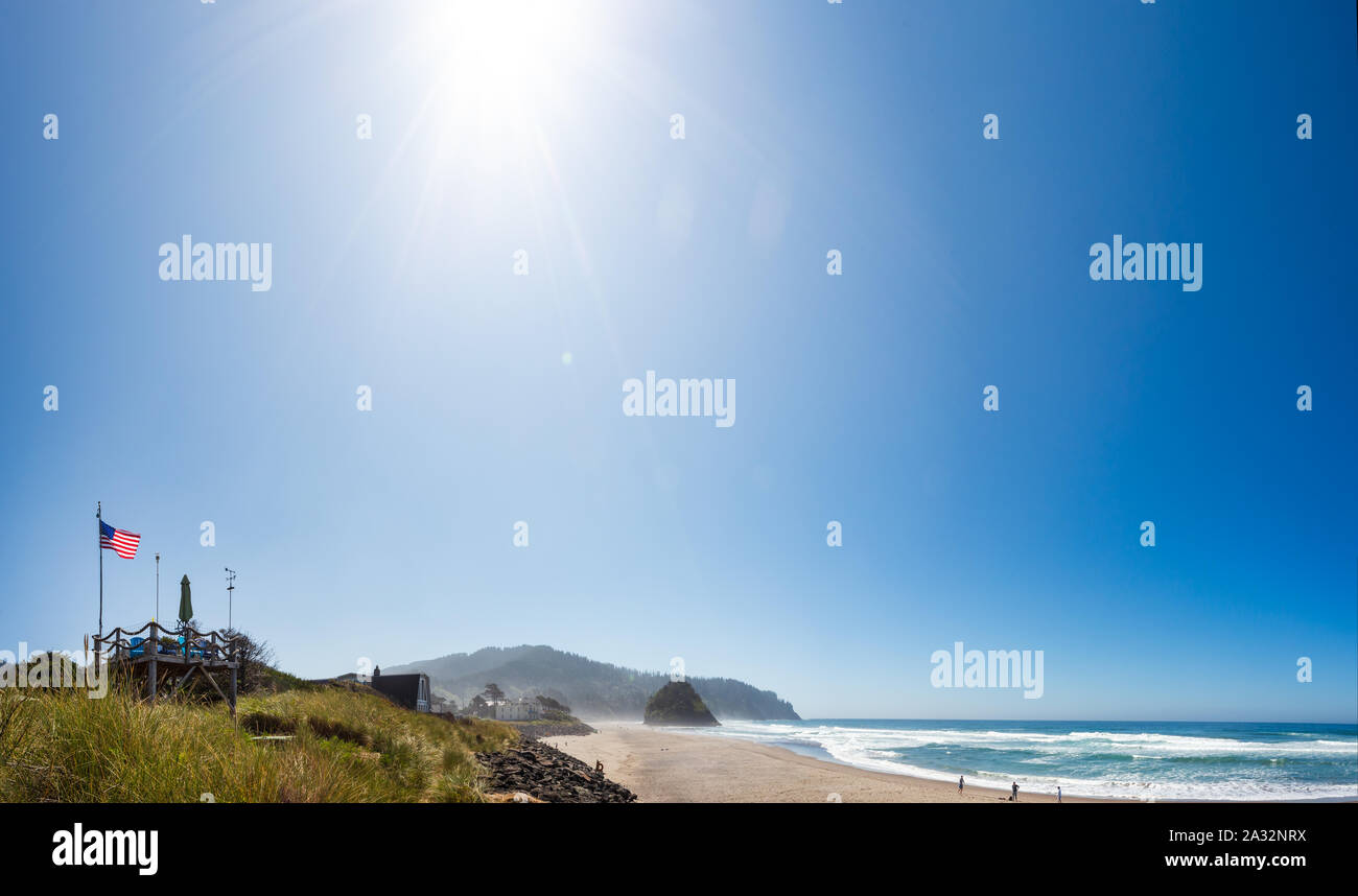 Shot of a beachfront home with an American flag on the Oregon coast