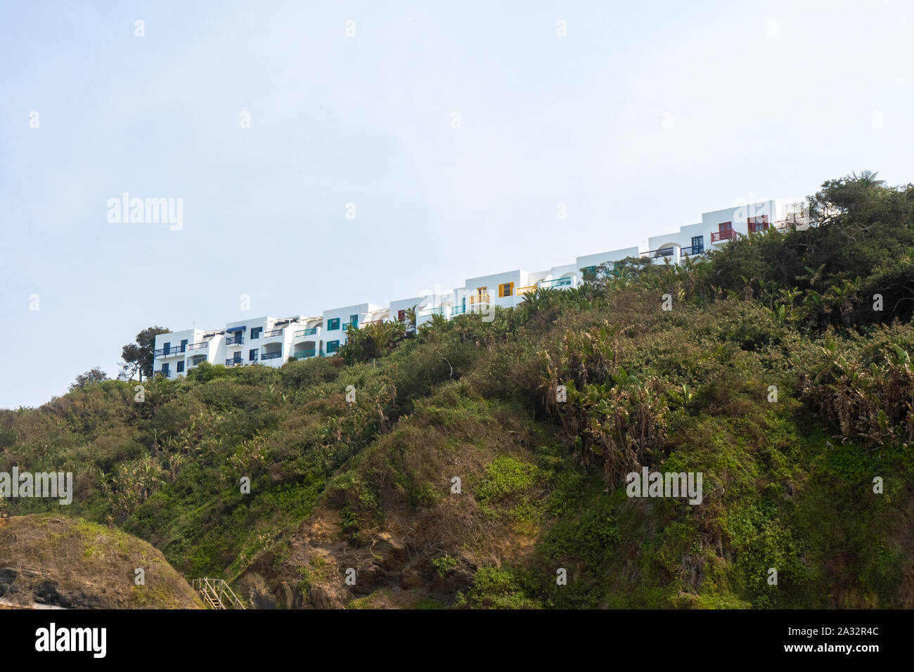Apartment buildings on top of the hill right on the shoreline at Santorini in Durban. Dolphin Coast. Stock Photo