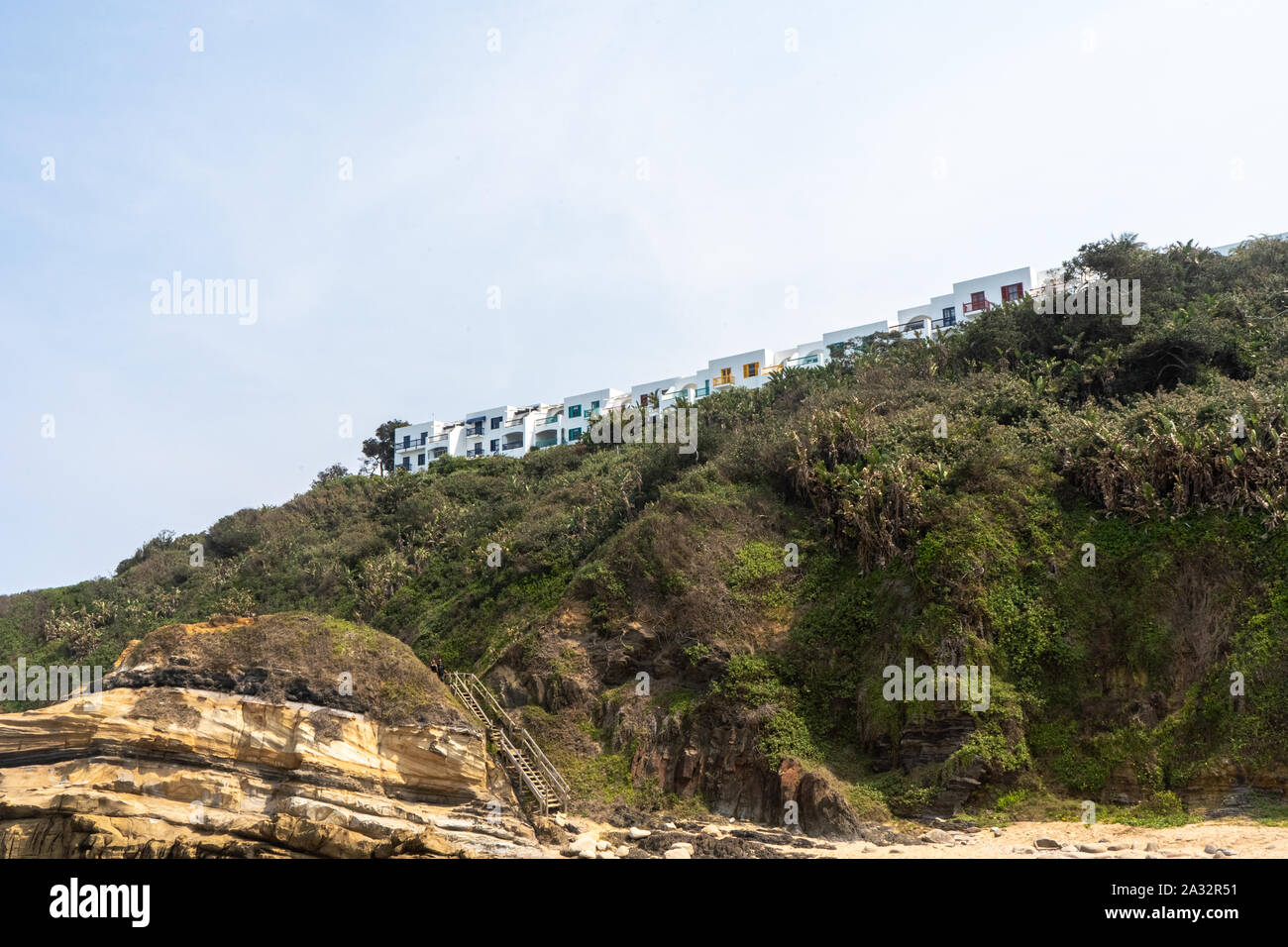Apartment buildings on top of the hill right on the shoreline at Santorini in Durban. Dolphin Coast. Stock Photo
