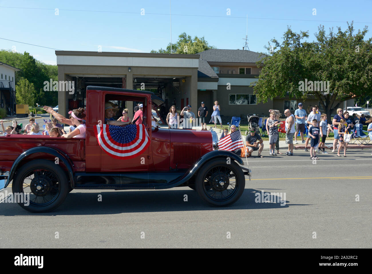 American flags, Float, July 4, Independence Day, 4th of July, Fourth of July, Parade, Star, Idaho, USA, Chevrolet, Corvette, Jeep, Model T Stock Photo