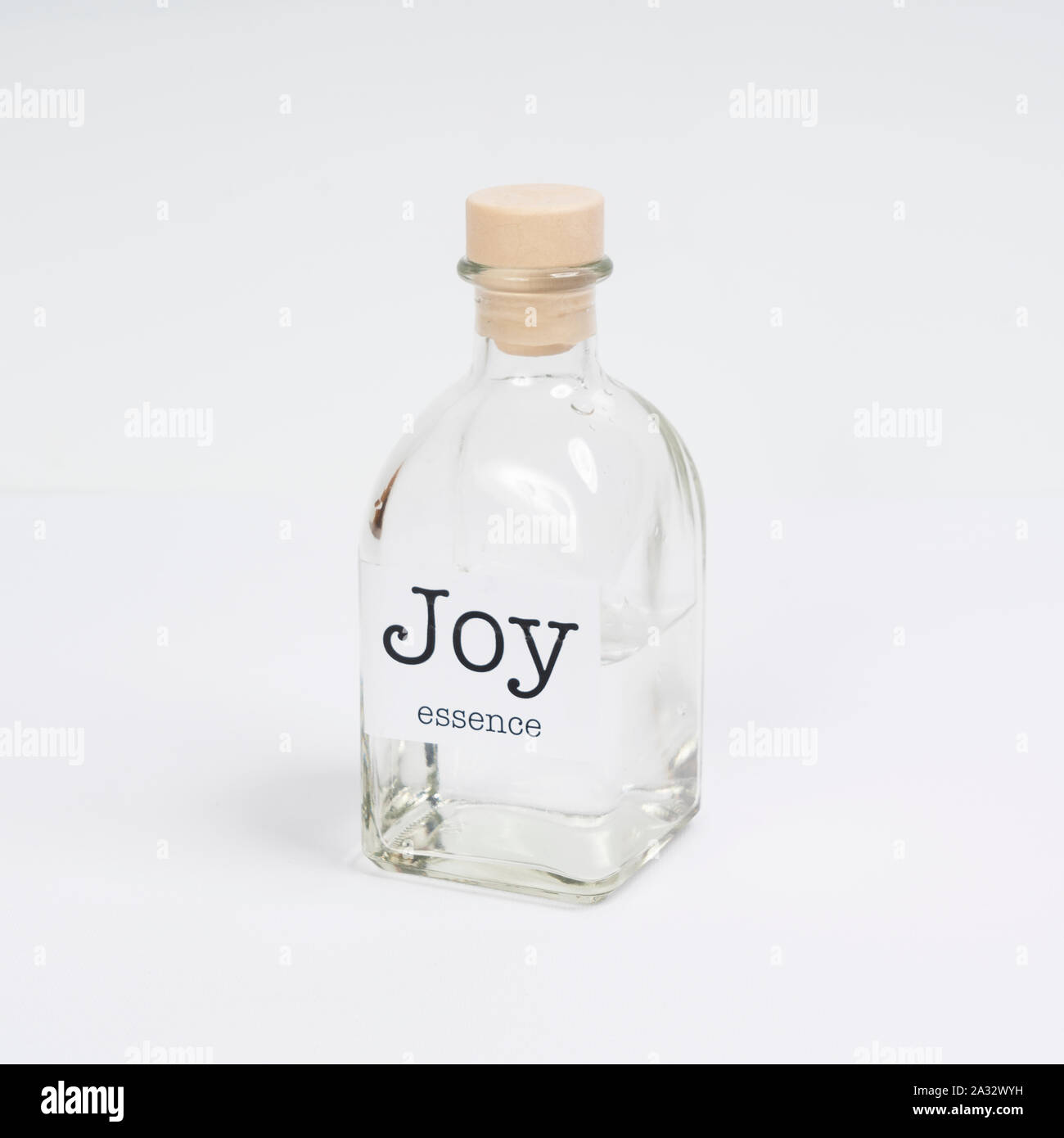 a glass bottle containing Joy essence Stock Photo Alamy