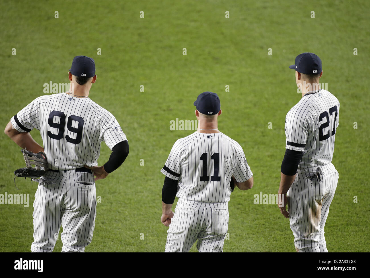 Bronx, USA. 04th Oct, 2019. New York Yankees Aaron Judge, Brett Gardner and Giancarlo  Stanton stand together in the outfield during pitcher change in the 5th  inning against the Minnesota Twins in
