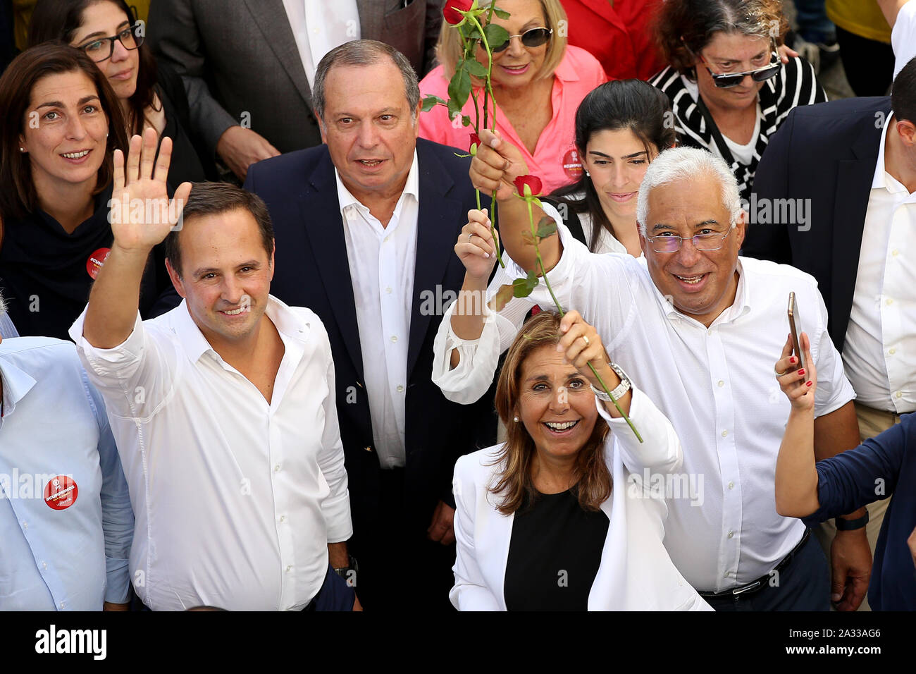 Lisbon, Portugal on Oct. 4. 6th Oct, 2019. Portuguese Prime Minister and leader of the Socialist Party Antonio Costa (front R) greets supporters with his wife Fernanda Tadeu (front) and Mayor of Lisbon Fernando Medina (front L) during a campaign rally in Lisbon, Portugal on Oct. 4, 2019. The Portuguese general elections will be held on Oct. 6, 2019. Credit: Pedro Fiuza/Xinhua/Alamy Live News Stock Photo