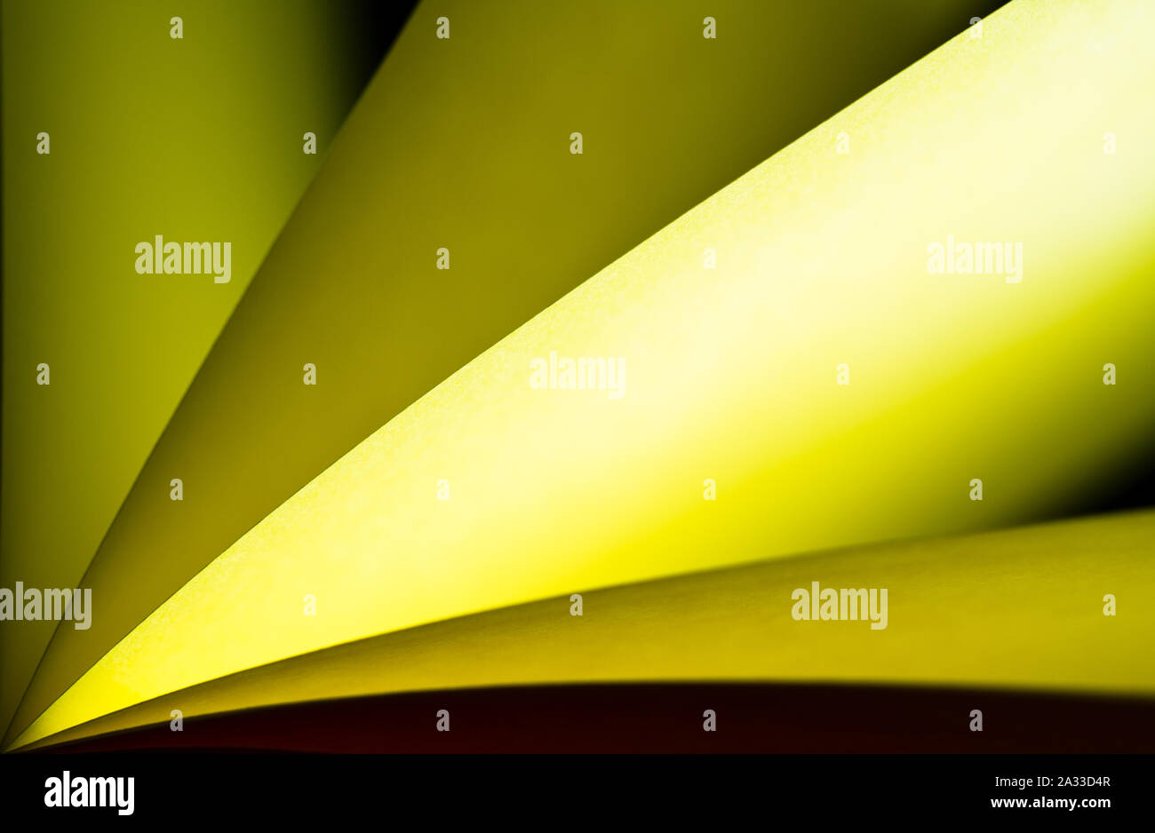 bright yellow colored illuminated notepad in various position and ...