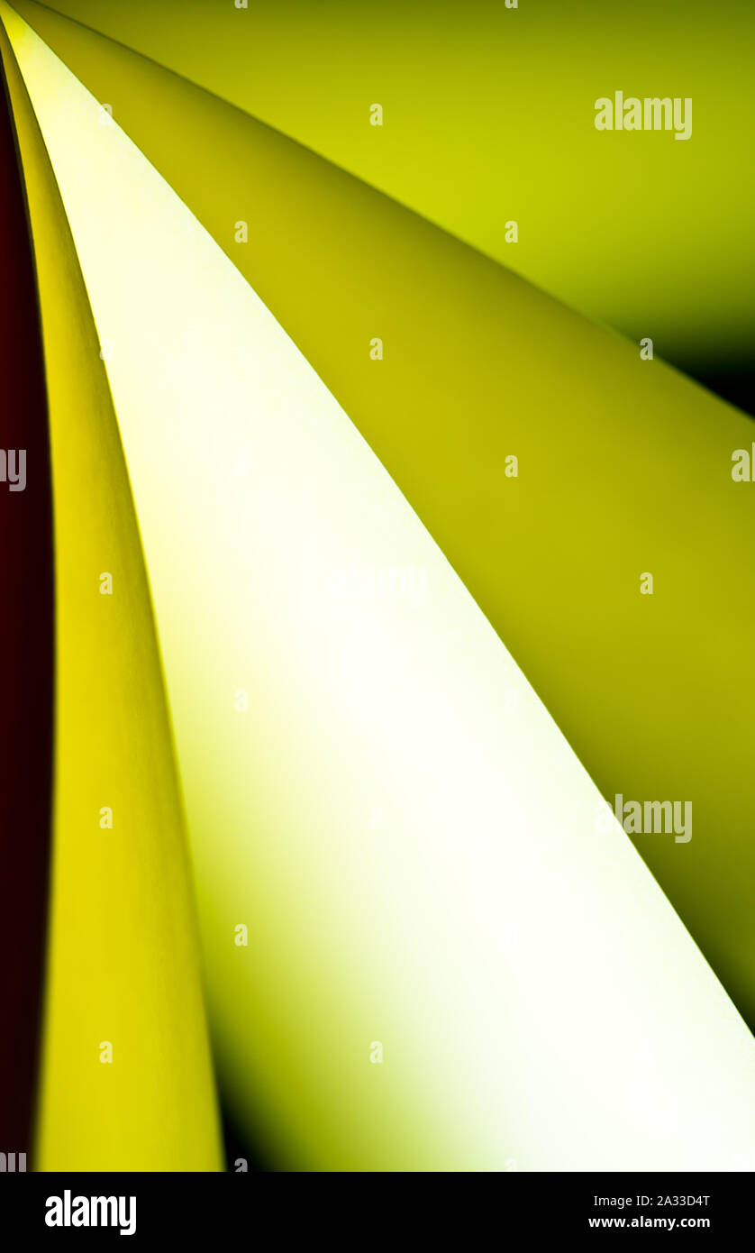 bright yellow colored illuminated notepad in various position and ...