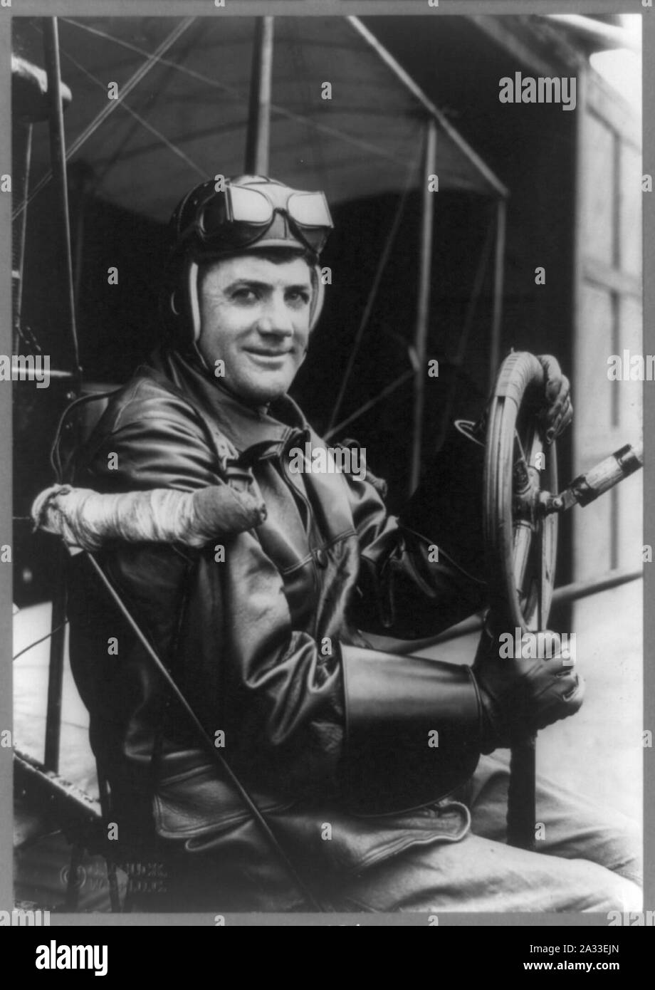 F.B. Hennessy, Army aviator, three-quarter length portrait, seated at steering wheel of airplane, facing right, in aviator's clothes Stock Photo