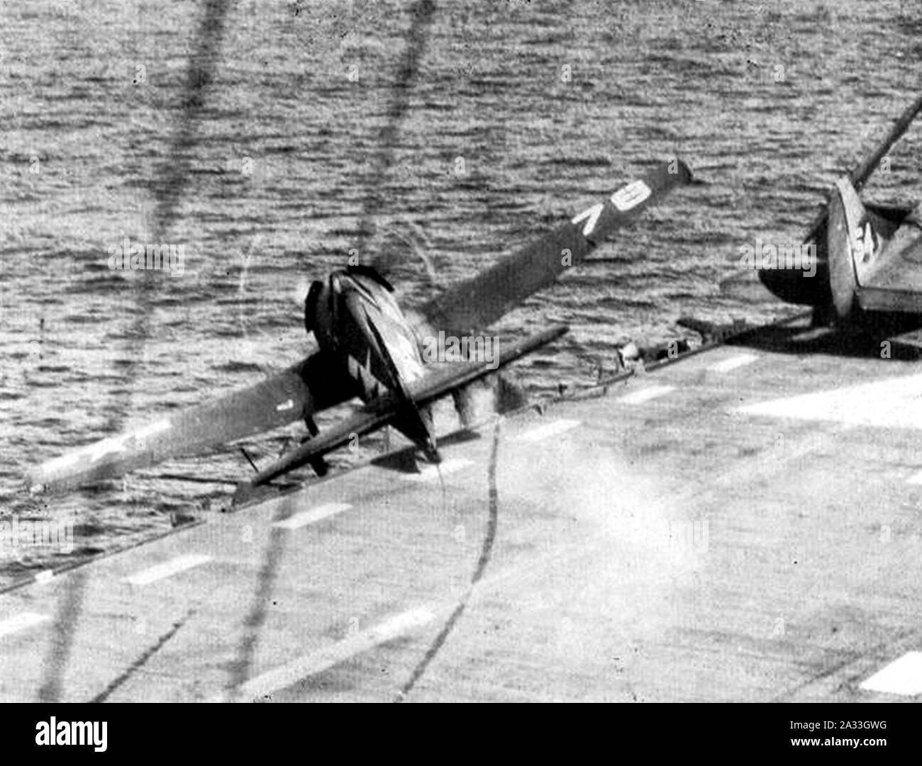 F6F Hellcat crashing over the side of USS Saipan (CVL-48) circa in 1946. Stock Photo