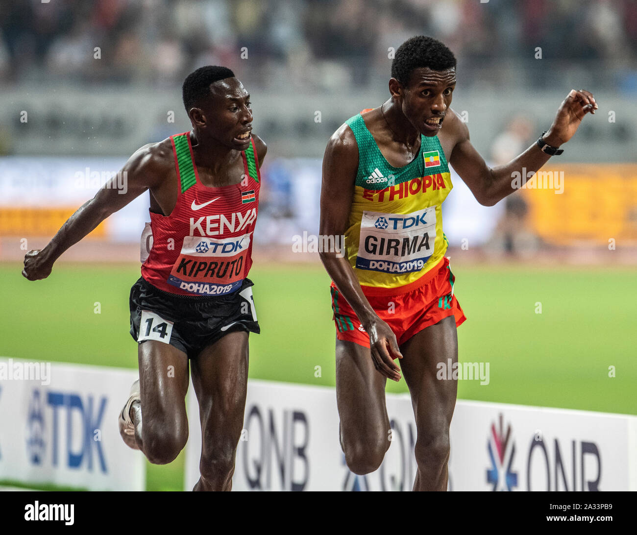 Doha, Qatar. 04th Oct, 2019. Conseslus Kipruto of Kenya and Lamche Girma of Ethiopia race at the finishing line in the 3000m steeplechase on day 8 of the 17th IAAF World Athletics Championships 2019, Kalifa International Stadium. Credit: SOPA Images Limited/Alamy Live News Stock Photo