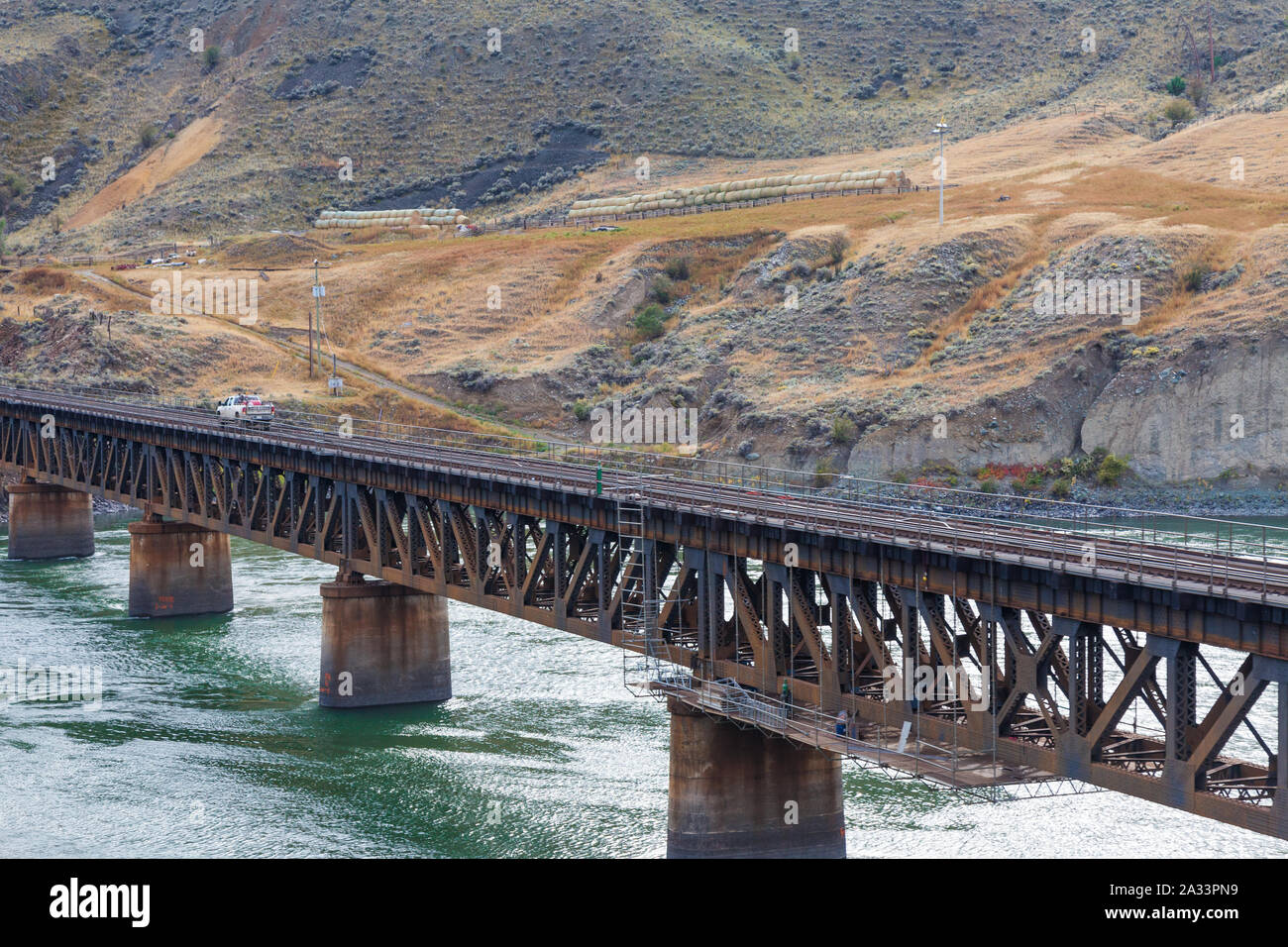 Canadian National railway bridge crossing the Thompson River south of Ashcroft in British Columbia Canada seen from the Rocky Mountaineer tourist trai Stock Photo