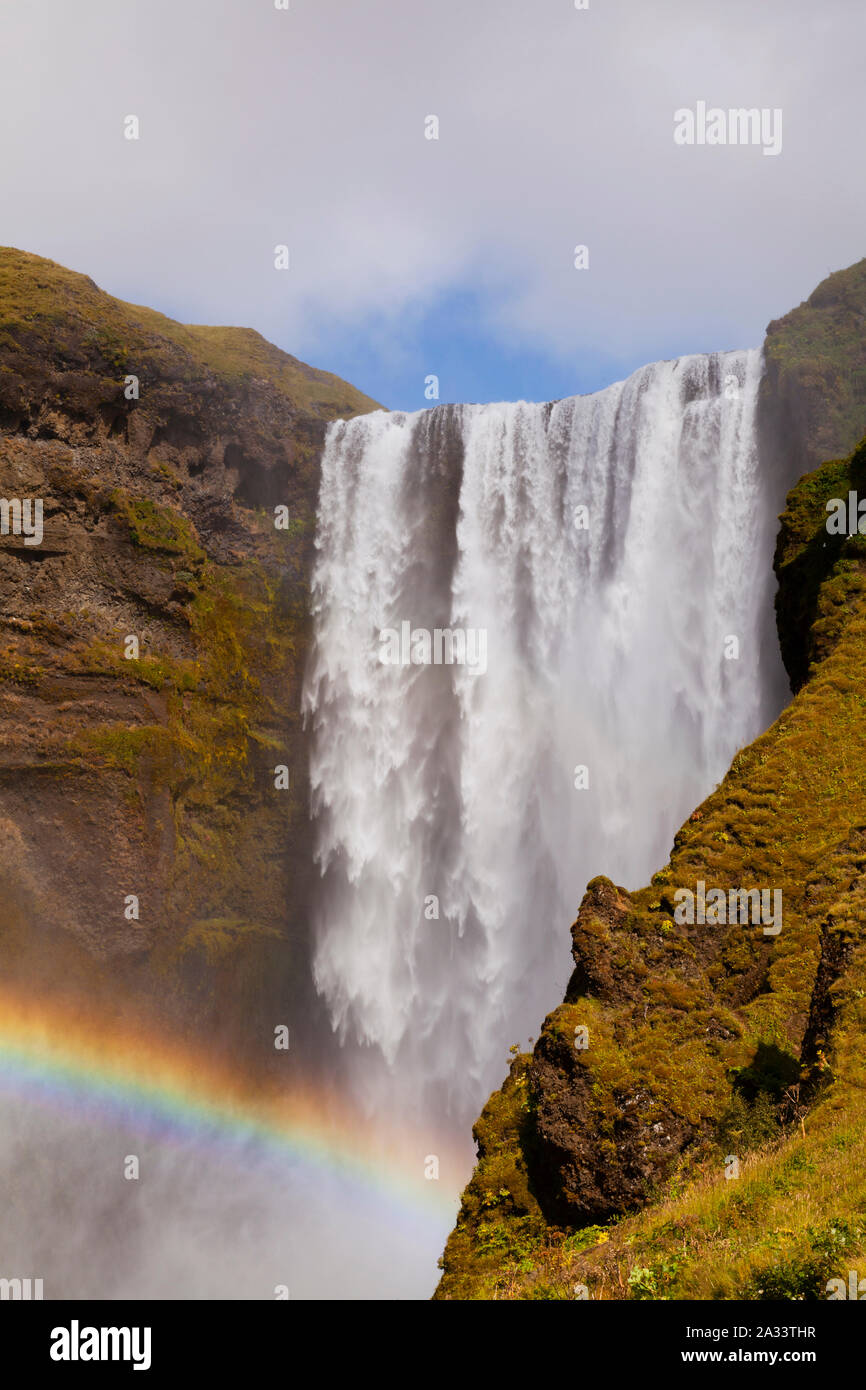 Skogarfoss waterfall with rainbow, Iceland Stock Photo