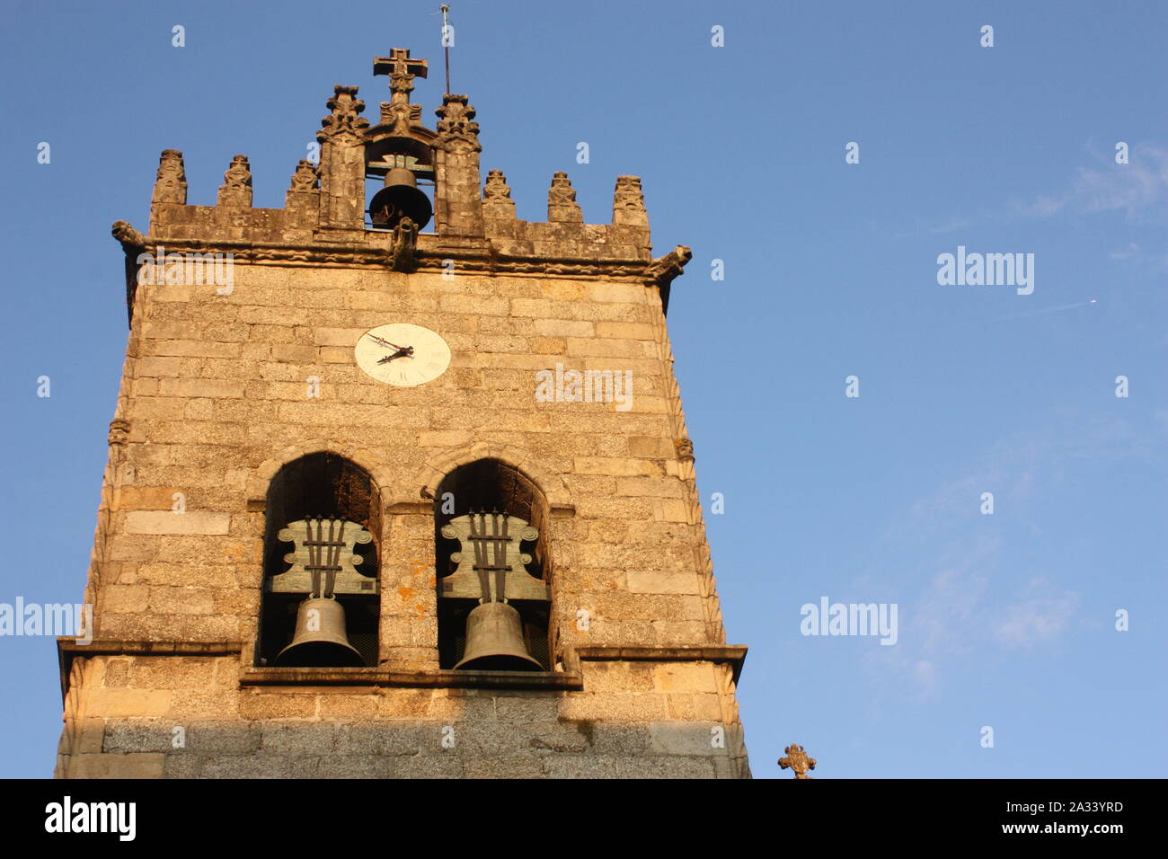 Guimaraes, Portugal - The tower of the Igreja de Nossa Senhora da Oliveira - taken at 7:50pm Stock Photo