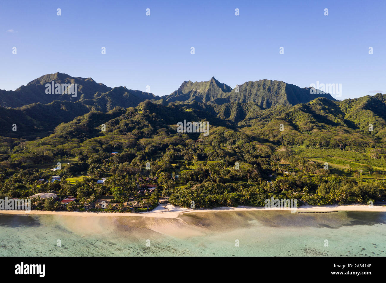 The idyllic Rarotonga island, part of the Cook islands, in the Pacific ocean, with its jungle covered mountain and stunning beach. Stock Photo