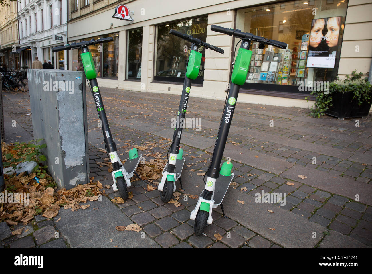 Lime electric scooters seen on a sidewalk in Gothenburg Stock Photo Alamy