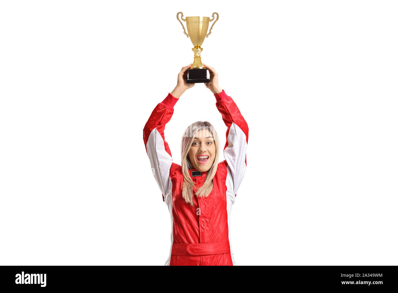 Happy female racer holding a golden trophy cup isolated on white background Stock Photo