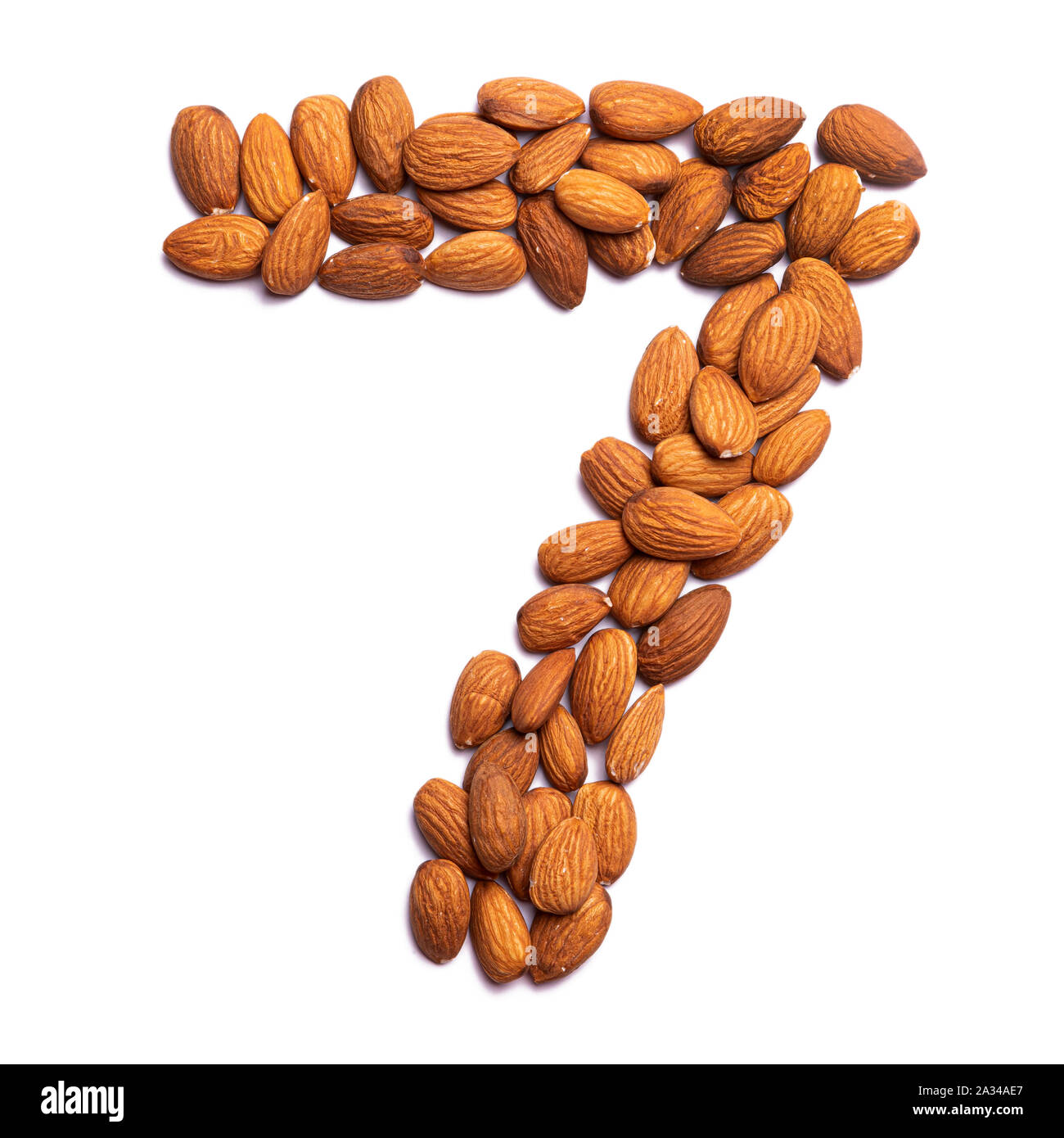 Arabic numeral "7" from a peeled almond on a white isolated background