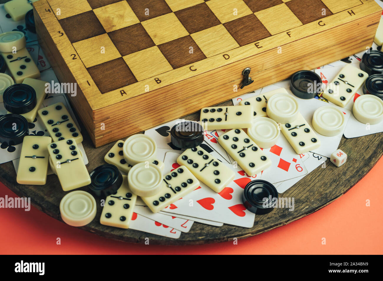 Close up Various board games chess board, playing cards, dominoes on a