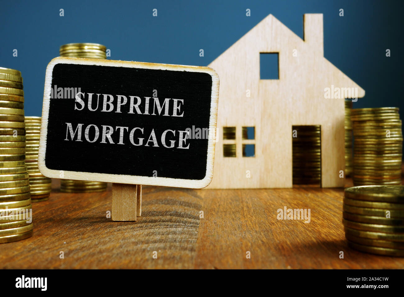 Subprime mortgage plate and model of home. Stock Photo