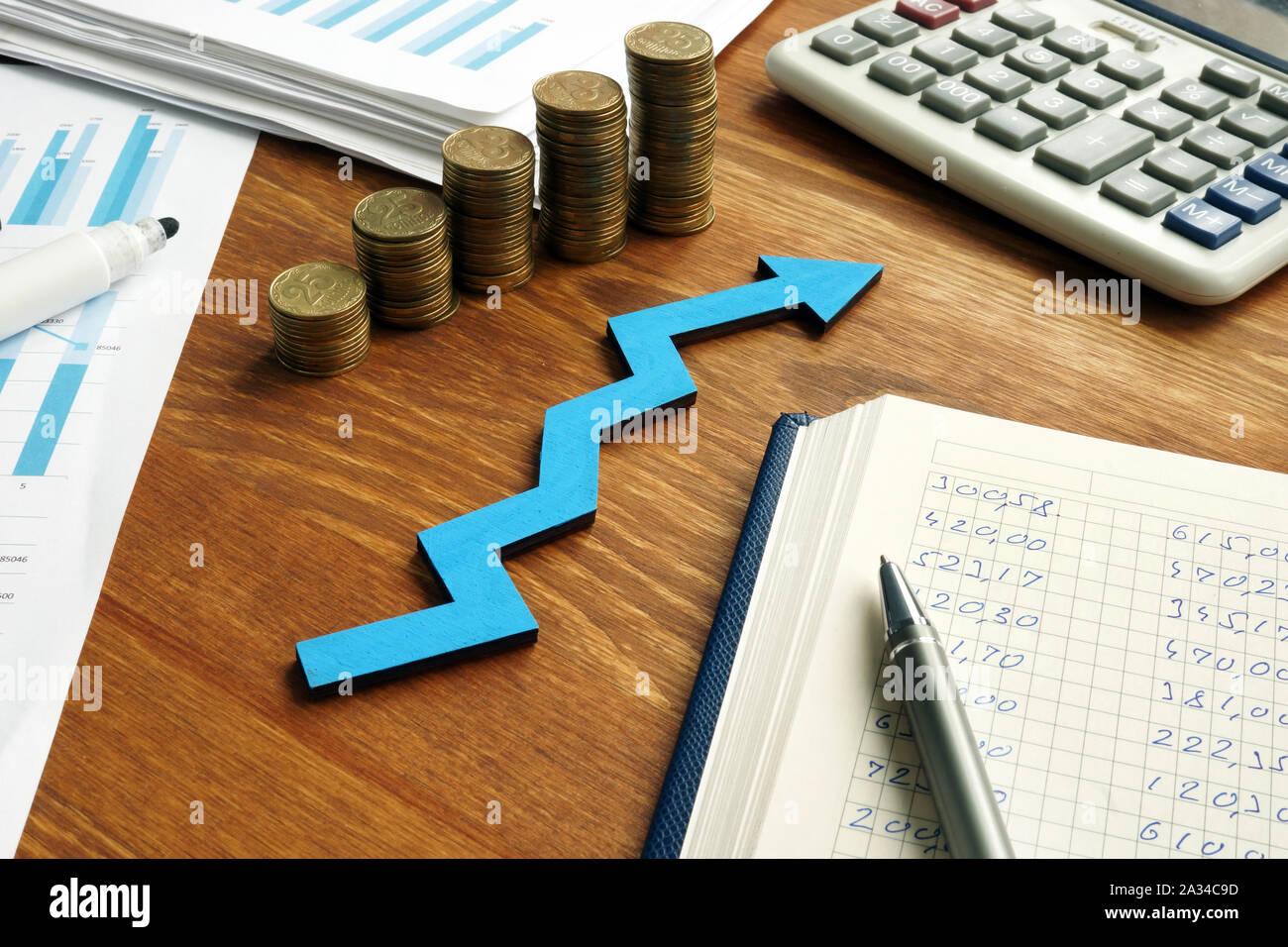 Growth business success with blue arrow and financial report. Stock Photo