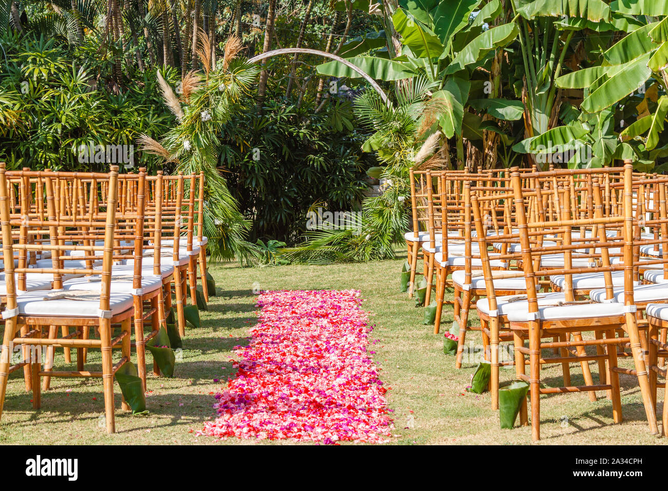 Round wedding arch in Boho style for a ceremony decorated with fresh