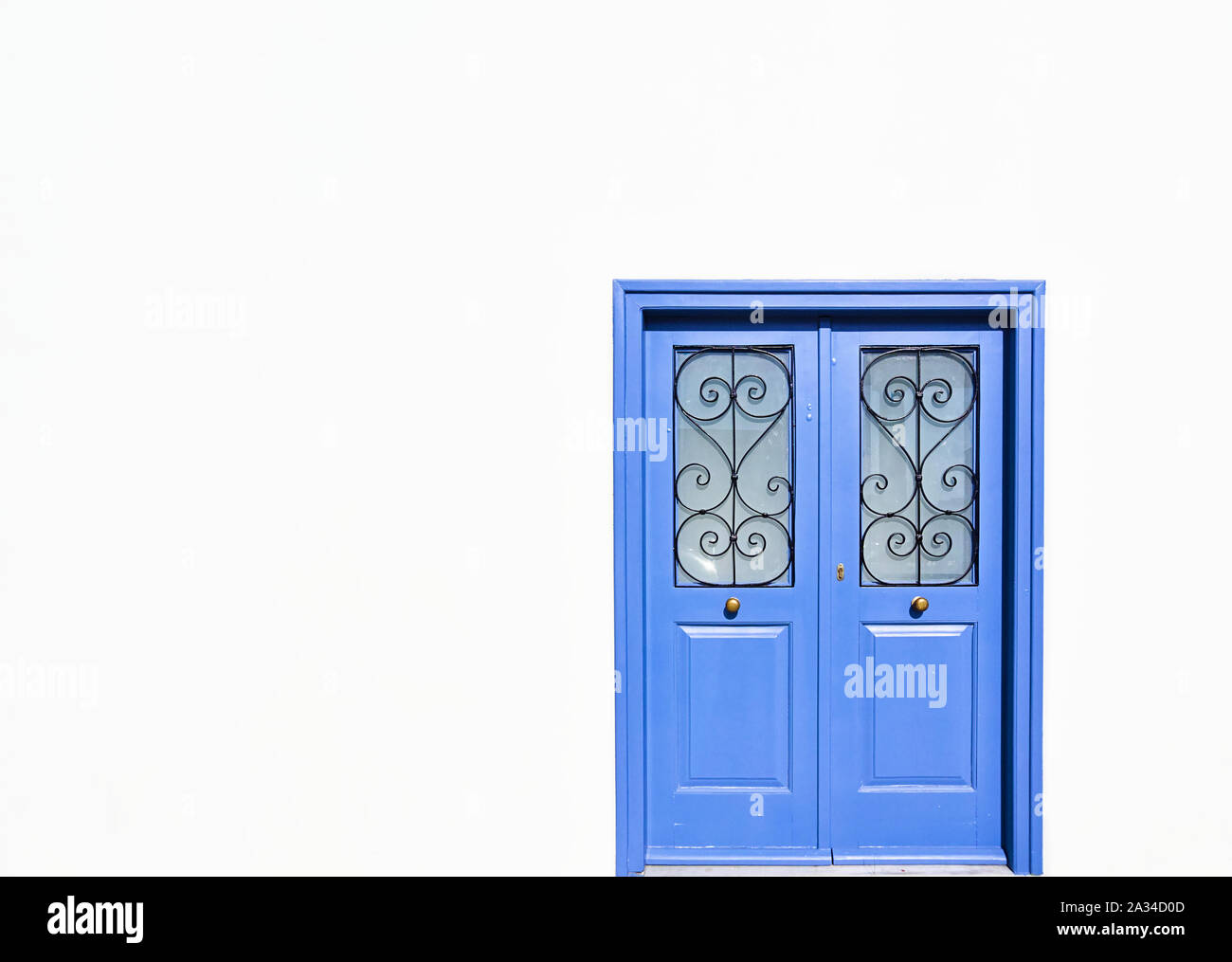 Blue Wooden Door Of Traditional Design On White Wall Minimal Architectural Image Stock Photo Alamy