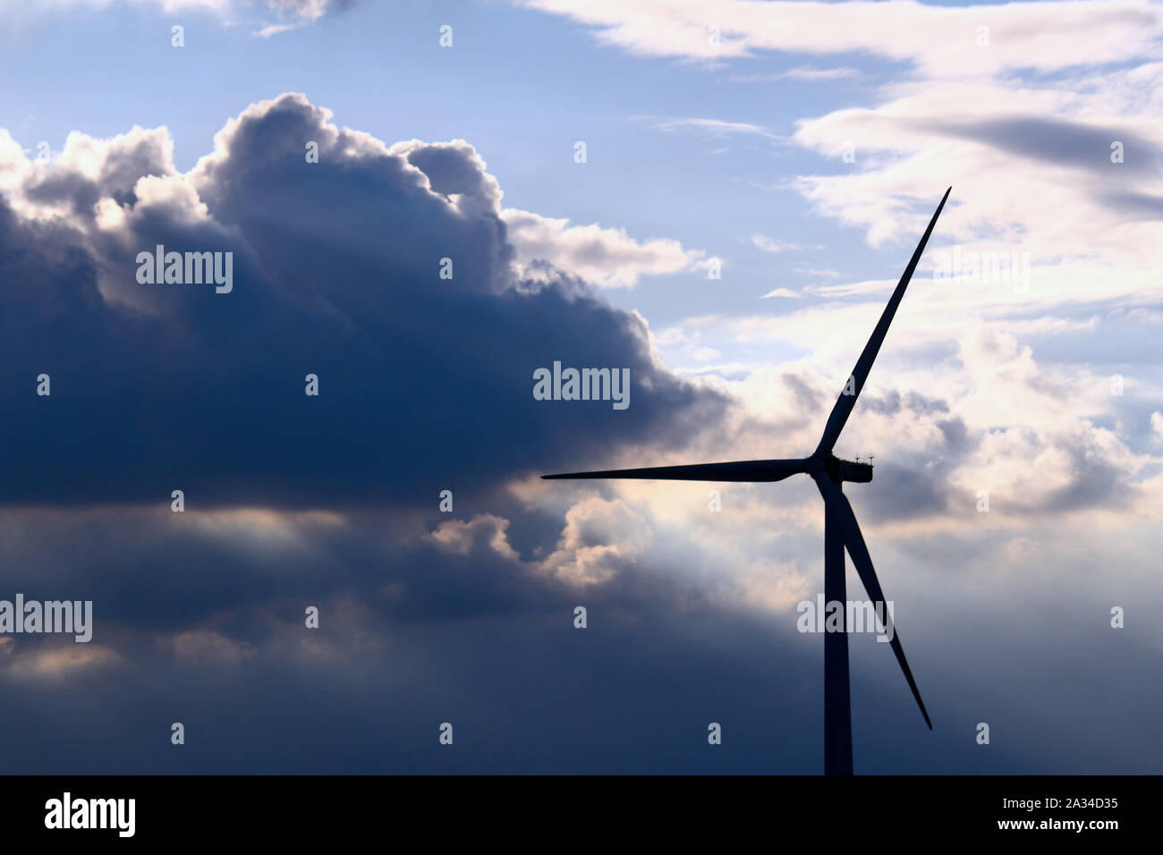 A wind power generator built in a dramatic sky Stock Photo