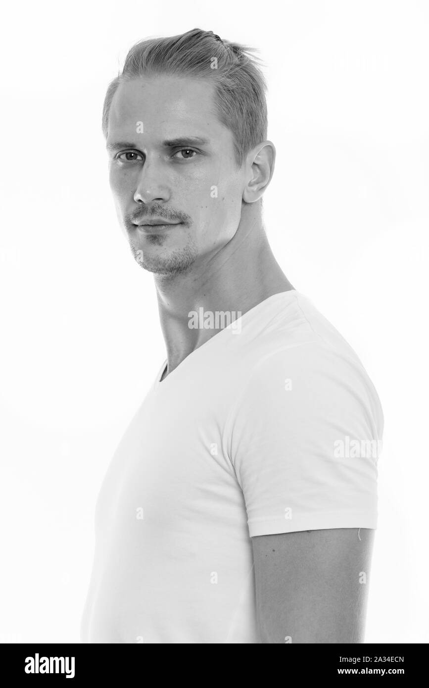 Studio shot of young handsome man in black and white Stock Photo - Alamy