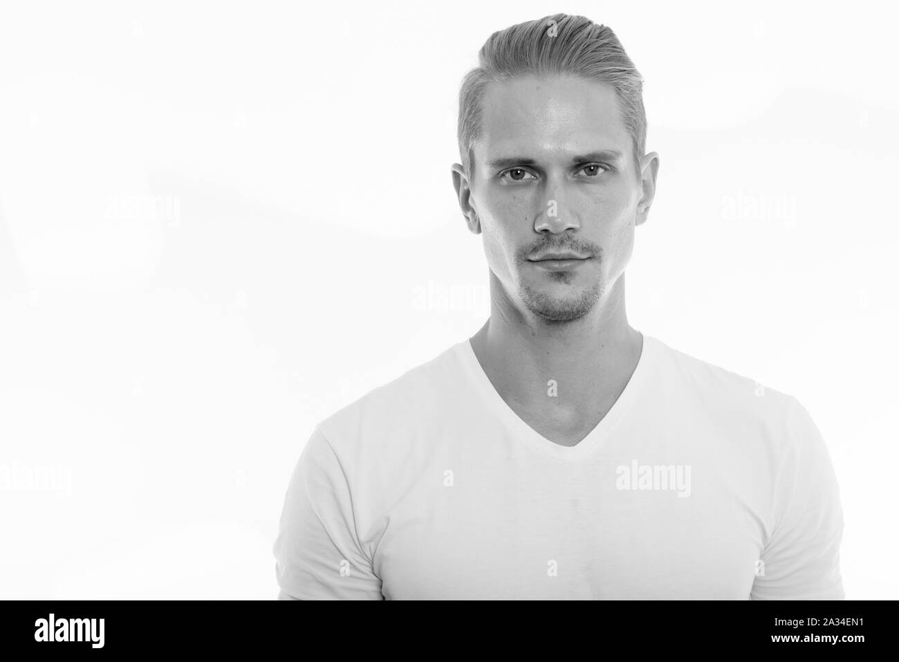 Studio shot of young handsome man in black and white Stock Photo - Alamy