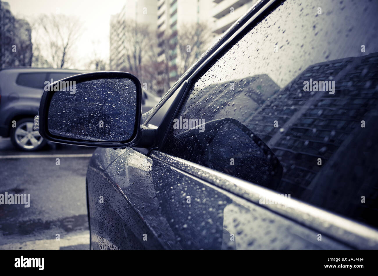 Rain on car mirror window hi-res stock photography and images - Alamy