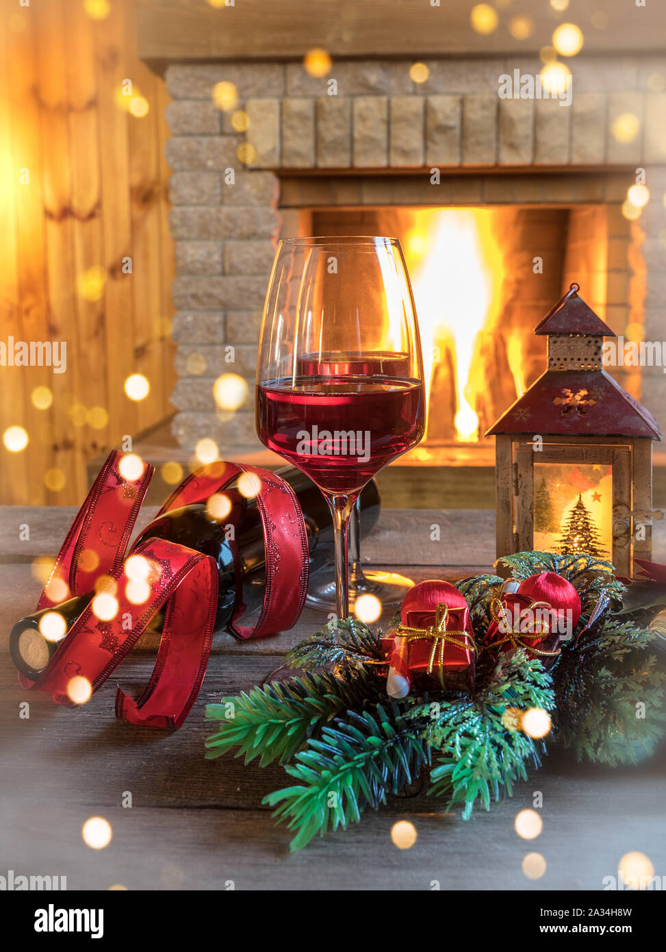 Cozy Scene Before Fireplace With Glasses Of Wine Candles And
