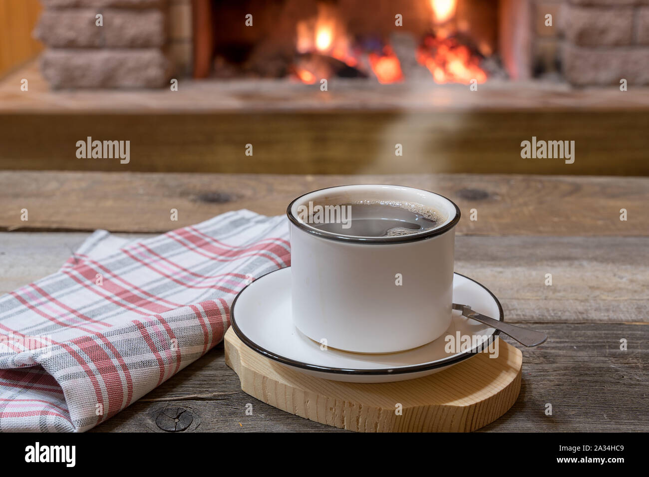 https://c8.alamy.com/comp/2A34HC9/cozy-scene-before-fireplace-with-a-cup-of-tea-in-country-house-winter-vacation-2A34HC9.jpg