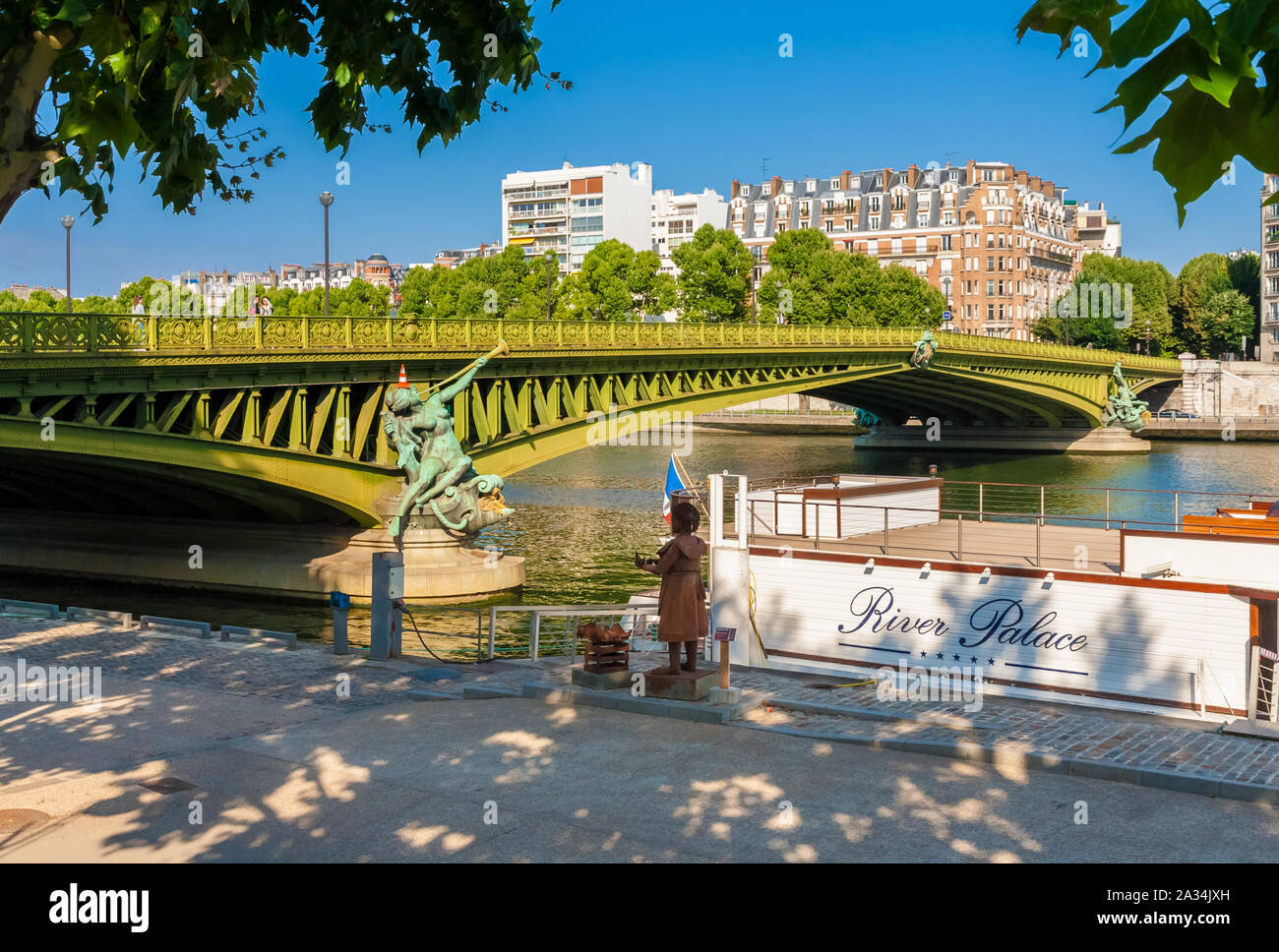 Lovely view of the Pont Mirabeau with the allegorical statue 'Abundance' from the Port de Javel Haut in Paris, France. The arch bridge spans the Seine... Stock Photo