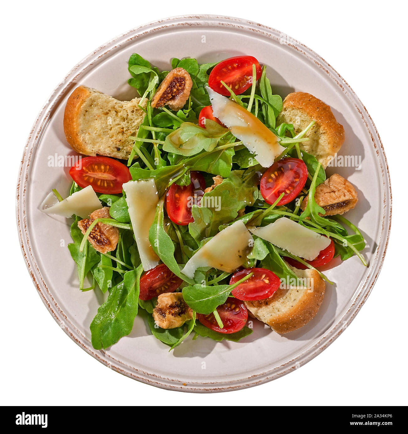 Fresh salad bowl with arugula,parmesan,rusks and vinaigrette Stock Photo