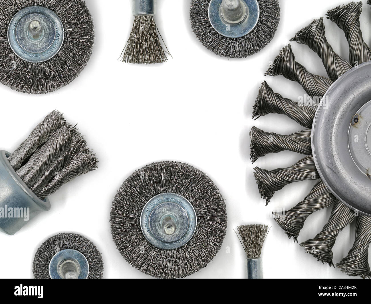 top view of metal brush for angle grinder and other brushes for metalworking isolated on white