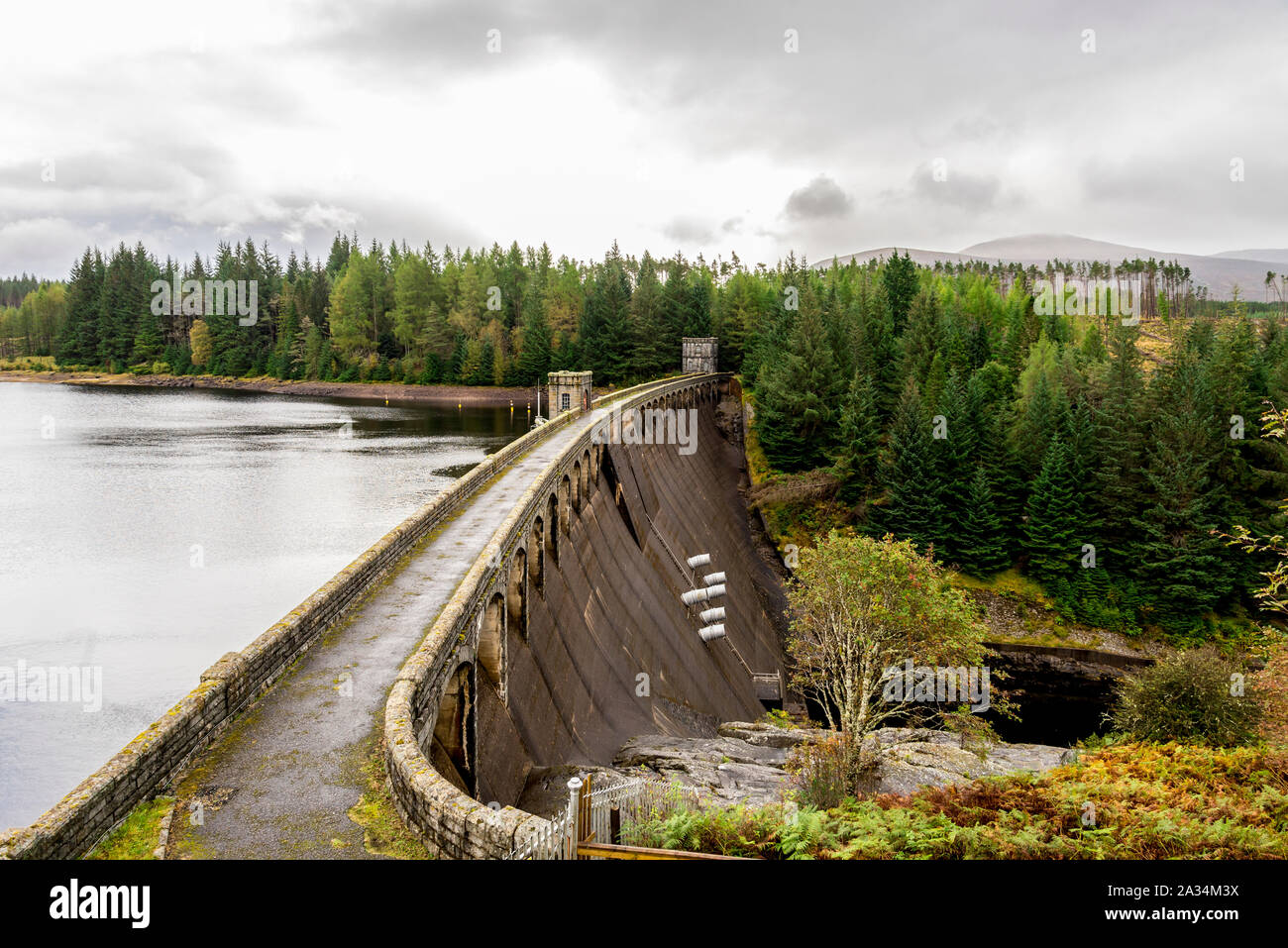 A view of Laggan Dam with 6 pipes to release water from the loch to river Spean, Scotland Stock Photo
