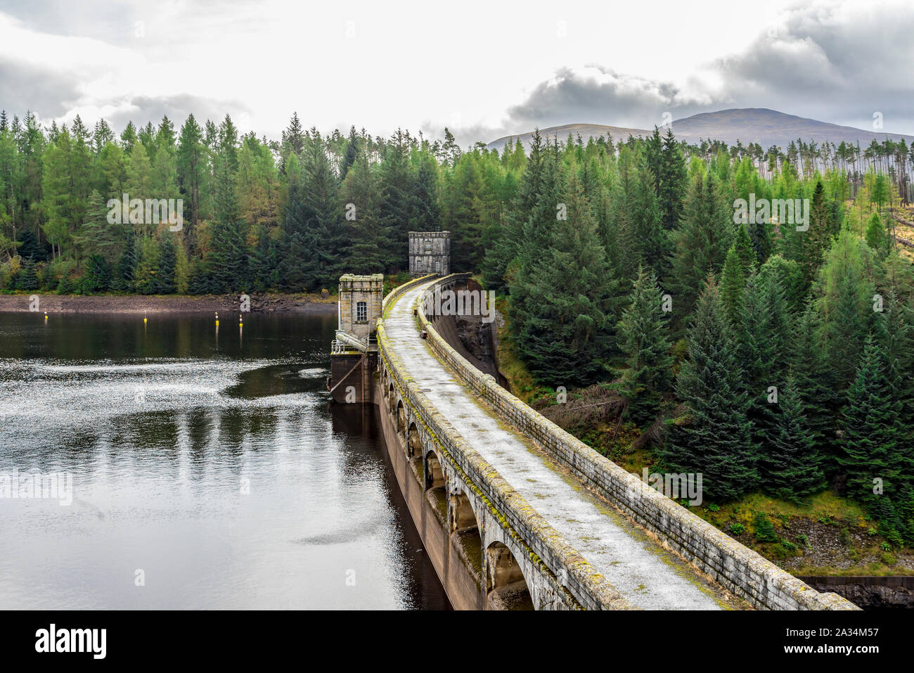 A road and a walkway on top of Laggan Dam construction, Scotland Stock Photo