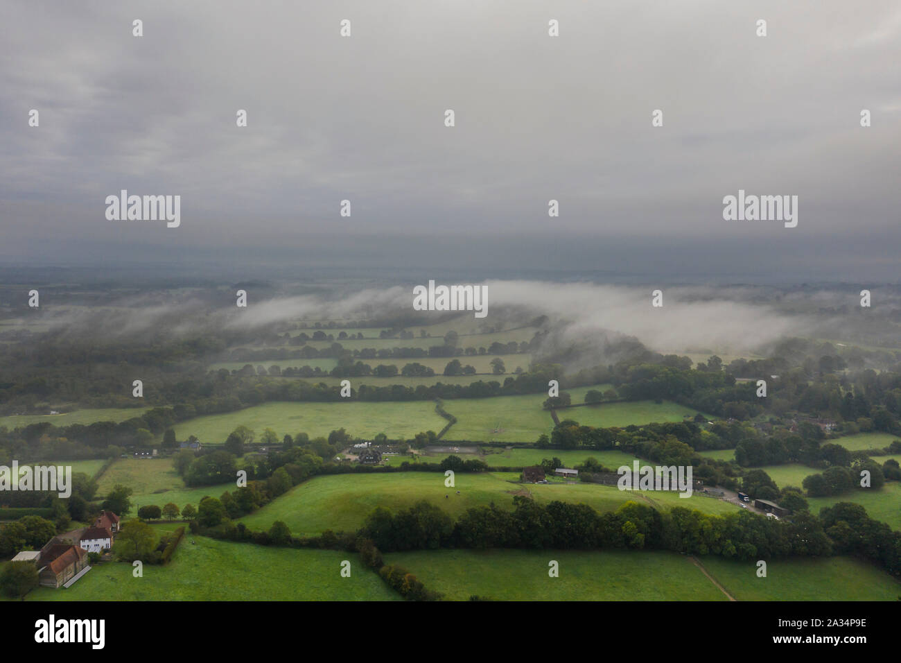 Sussex, UK. 05th Oct, 2019. A misty morning over the Redfold Vineyard and the Downs, Near Pulborough in Sussex. Credit: Guy Bell/Alamy Live News Stock Photo