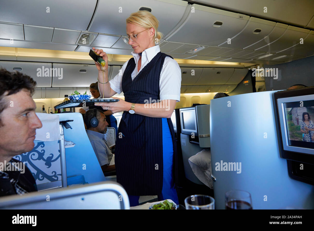 Netherlands Colombia stewardess offering wine in business class KLM Flight photo Jaco Klamer/Alamy Stock Photo