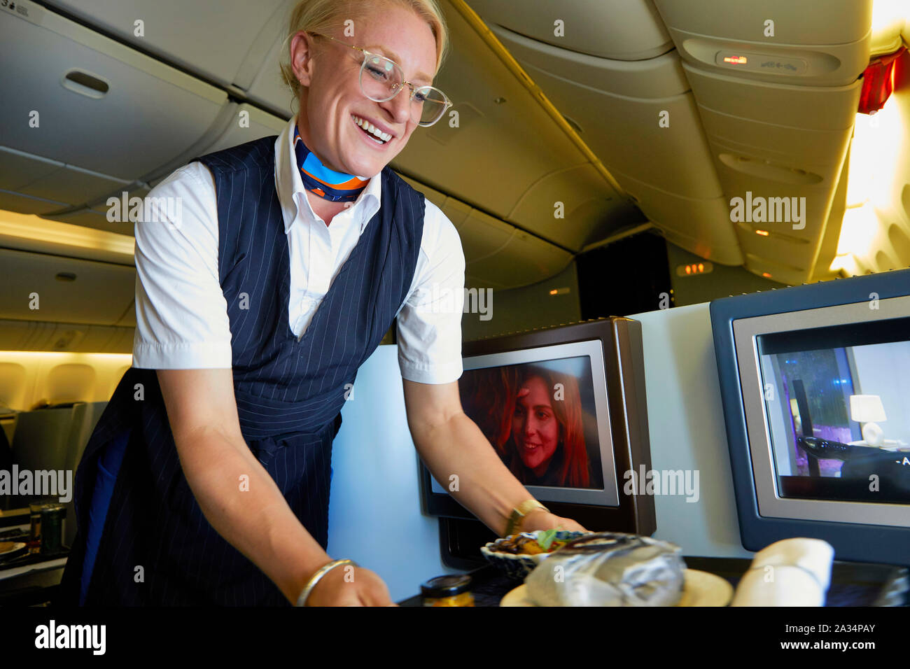 Netherlands Colombia stewardess offering wine in business class KLM Flight photo Jaco Klamer/Alamy Stock Photo