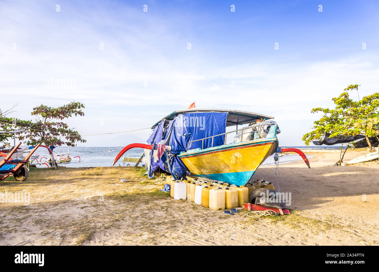 Colorful traditional fishing boat on balinese shore, Indonesia Stock Photo