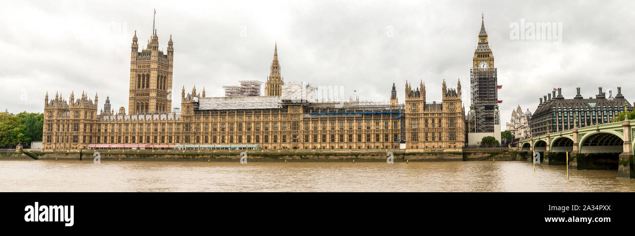 Houses of Parliament and Big Ben clock tower covered with scaffolding for restoration, London, England Stock Photo
