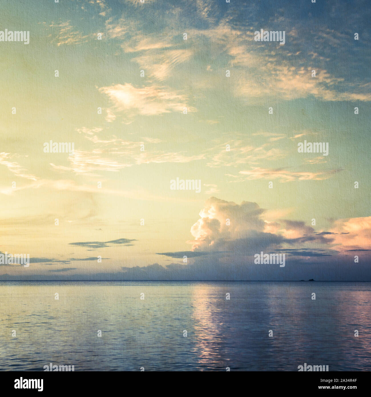 Blurred seascape with blue sky background on texture of paper Stock Photo