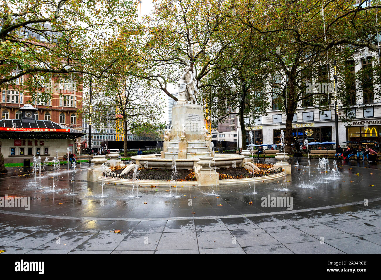 A statue of William Shakespeare and small fountain on Leicester Square in London, United Kingdom Stock Photo