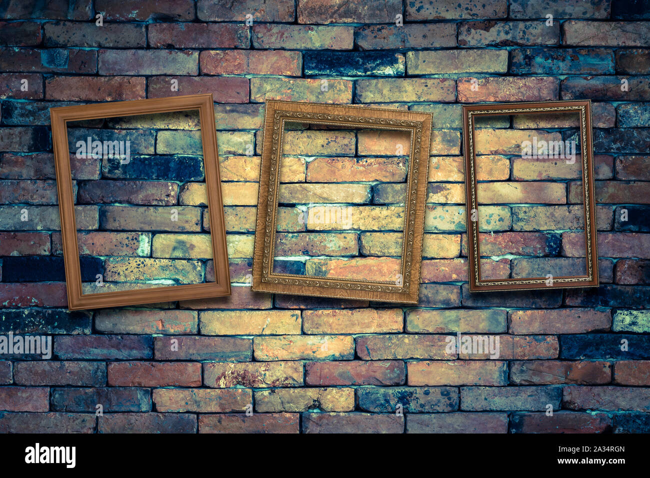 three wooden picture frame on grunge brick wall Stock Photo Alamy