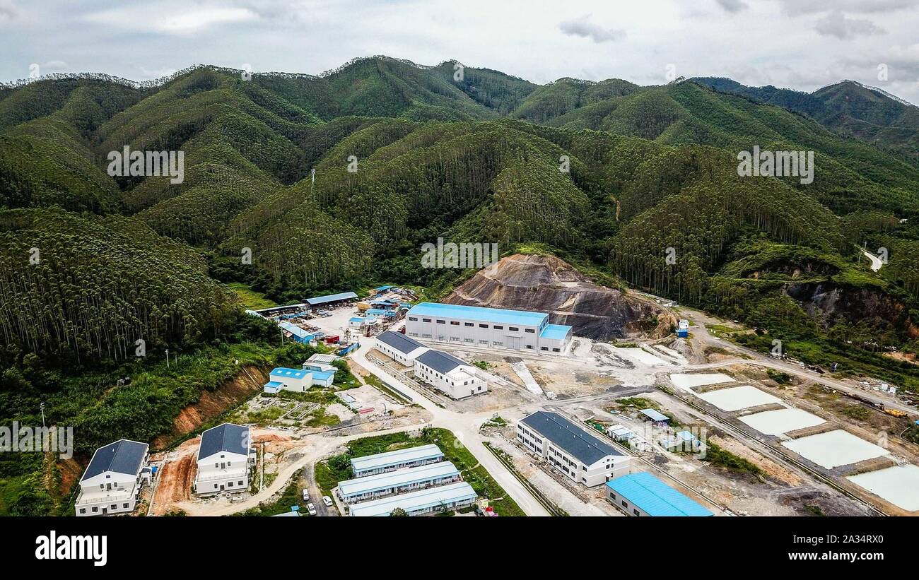 (191005) -- GUANGZHOU, Oct. 5, 2019 (Xinhua) -- Aerial photo taken on June 23, 2019 shows the construction site of the Jiangmen Underground Neutrino Observatory (JUNO) in Jiangmen, south China's Guangdong Province. (Xinhua/Liu Dawei) Stock Photo
