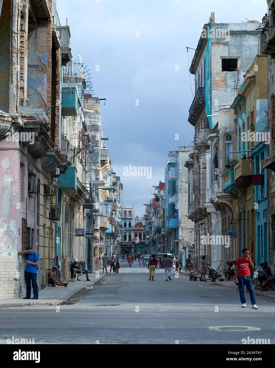 People walk the pavement and live life on the streets of Havana, Cuba ...