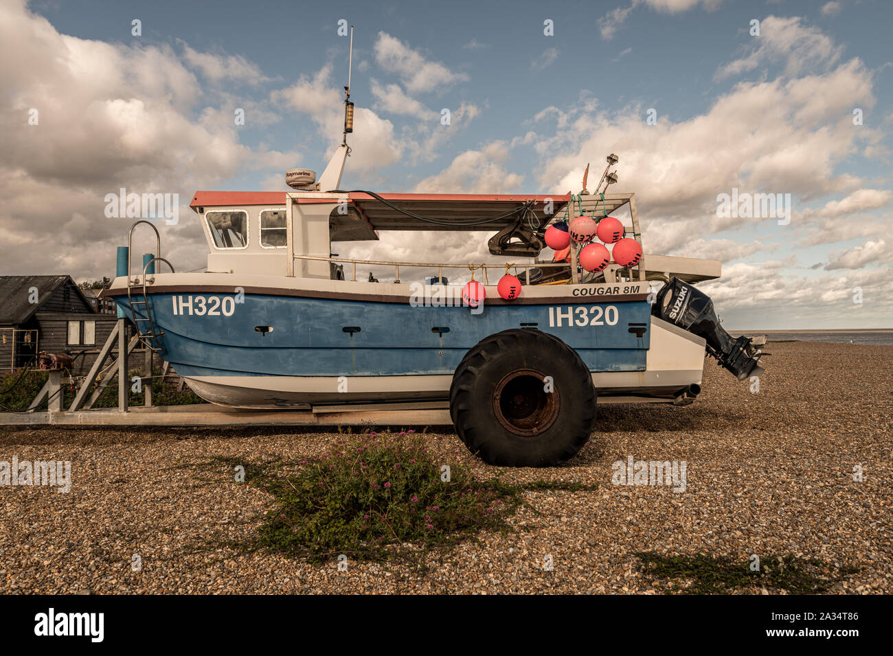 Old fishing boat on the shingle beach at aldeburgh hi-res stock ...